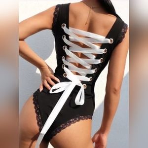 Black bodysuit w white laces black lace trim size X-Large NWOT
